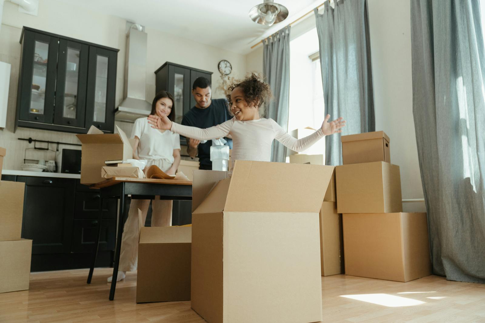 Family moving home in Pretoria with boxes and household furniture being loaded